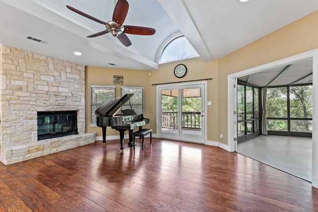 Open Living room with sunroom. | Image 13