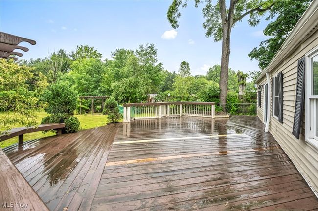 Wooden deck with view of scattered trees | Image 36