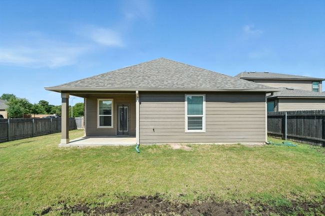 Back of property featuring a patio area, a shingled roof, and a fenced backyard | Image 29