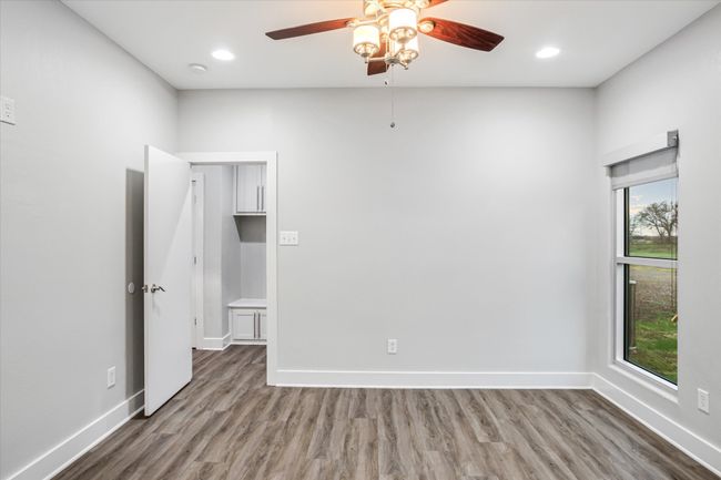 Spare room with wood-type flooring and ceiling fan | Image 25