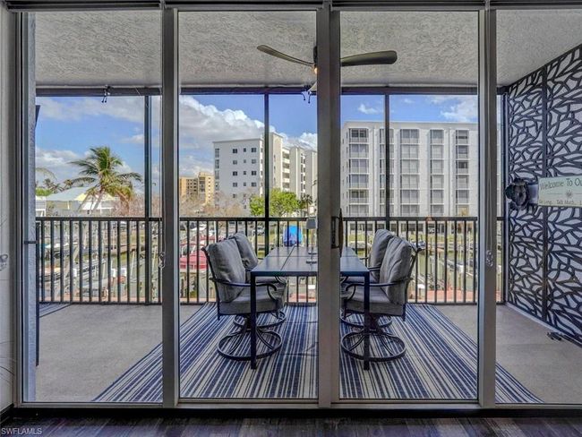 VIEW FROM LIVING AREA OF SPACIOUS SCREENED LANAI WITH EASTERN CANAL VIEWS | Image 5