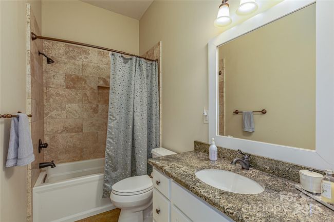 Full bath lower level bathroom with built in linen closet | Image 26