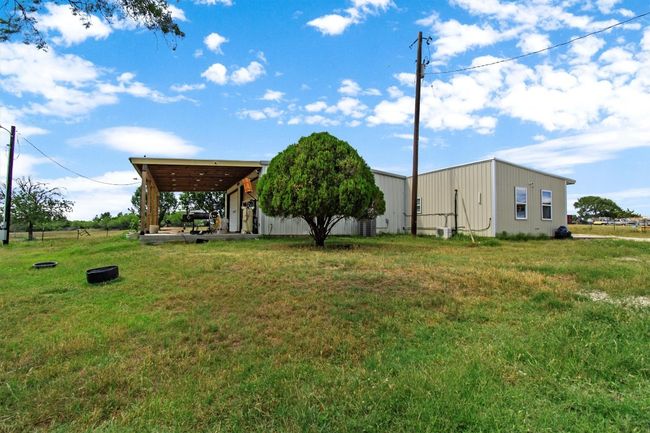 Nearby, a newer 800 sq ft duplex features two fully outfitted 400 sq ft units—each with a kitchen, tiled bath, and washer/dryer hookups—offering flexible guest or rental options. | Image 19