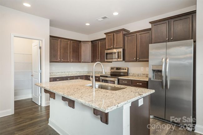 Second Downstairs Bedroom with spacious walk-in closet. | Image 23