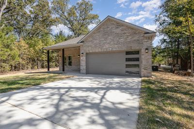 View of front of home with a front yard and a garage | Image 3