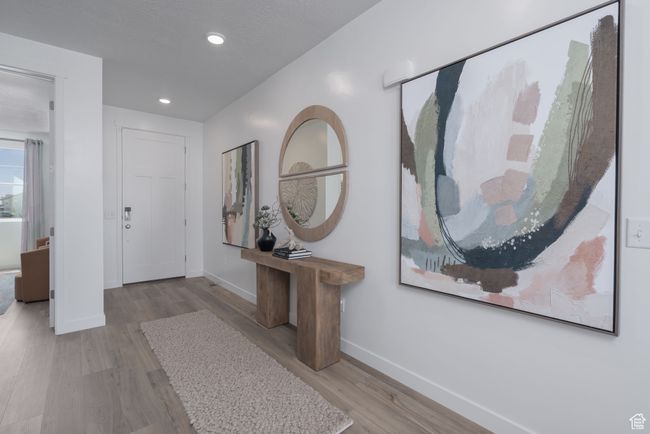 Foyer entrance with wood finished floors and recessed lighting | Image 29