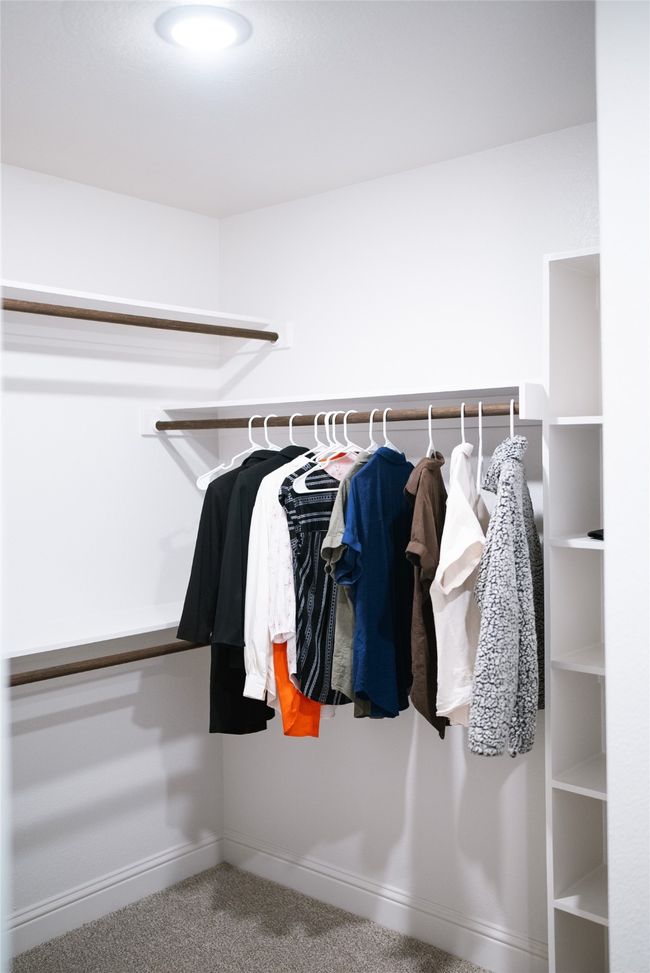 Spacious closet featuring carpet flooring | Image 17