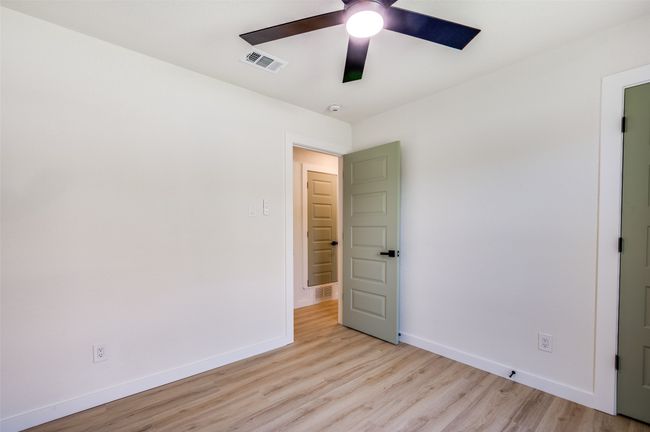 Unfurnished room with light wood-style floors and ceiling fan | Image 16