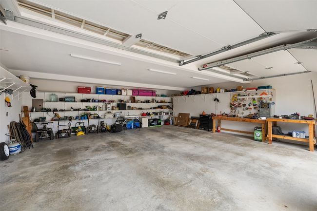 Garage featuring a workshop area | Image 38