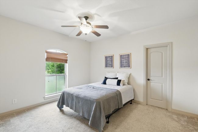 Carpeted bedroom featuring baseboards and a ceiling fan | Image 27