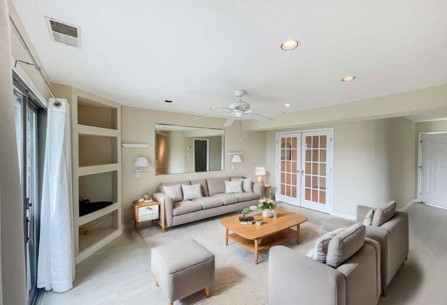 Living area featuring french doors, light wood-type flooring, visible vents, ceiling fan, and recessed lighting | Image 22