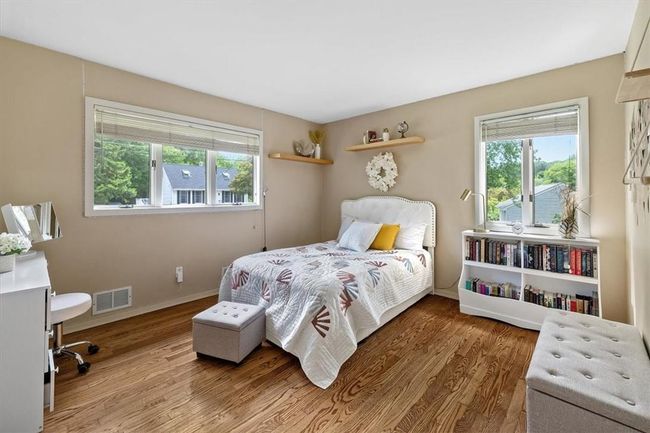 Bedroom with wood-type flooring | Image 11