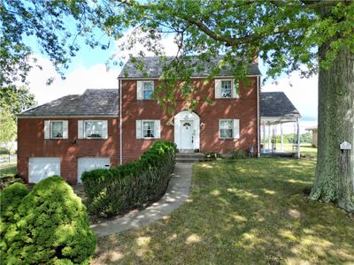 SPACIOUS Brick House on almost 1/2 Acre of Mostly Level Lot in Very Desirable Location just up from Caste Village | Image 1