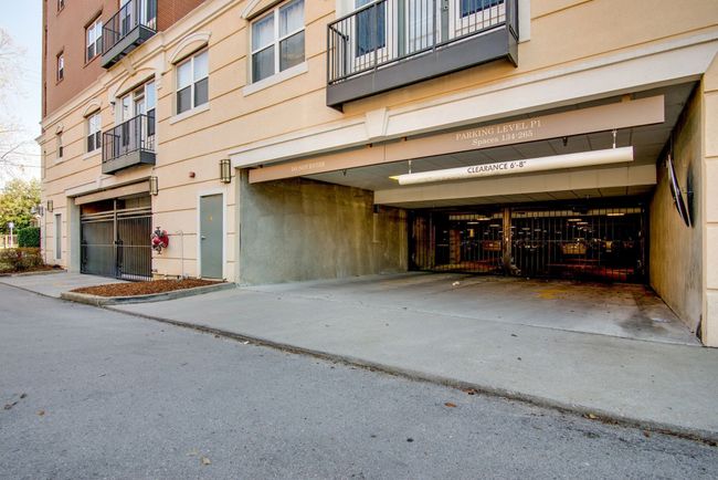 Enjoy the convenience and peace of mind that comes with your own assigned parking space in this secure, well-lit parking garage. | Image 30