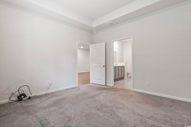 Empty room with light carpet and baseboards | Image 21