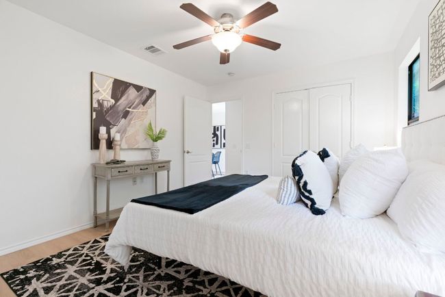 A thoughtful split-bedroom layout offers privacy, with the spacious primary suite situated at the back of the home. | Image 13