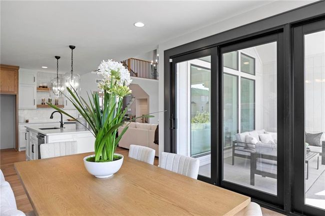 The dining area offers plenty of space for a large table. | Image 16