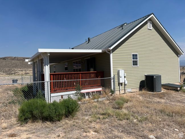 View of property exterior featuring a central AC unit | Image 11