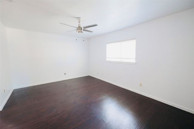 Master Bedroom featuring a ceiling fan and wood finished floors | Image 26
