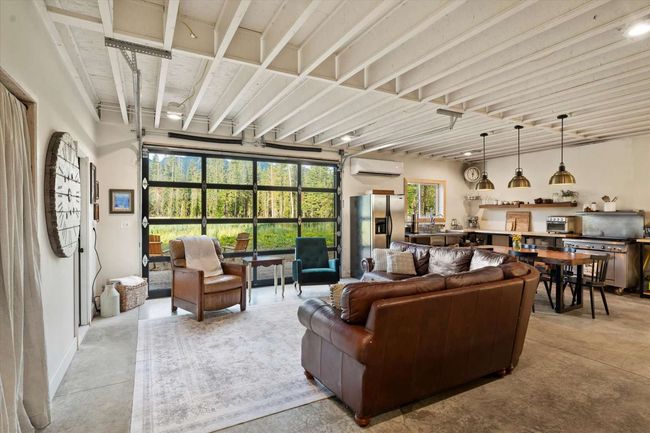 Living area featuring an AC wall unit | Image 15