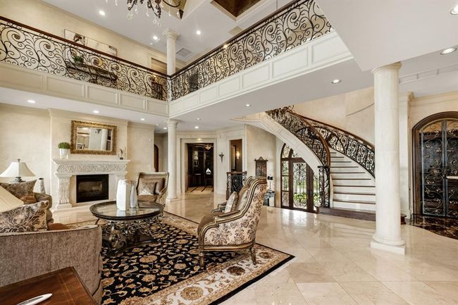 view towards fireplace, staircase, and primary bedroom | Image 13
