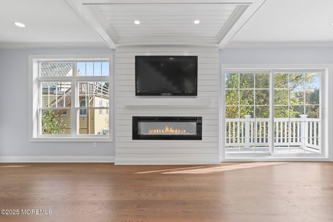 linear fireplace, sliding doors to balcony | Image 23