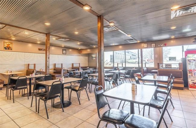 View of tiled dining space | Image 5
