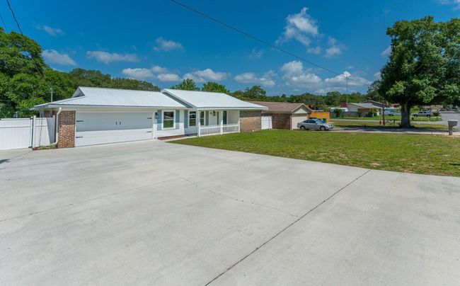 DELUXE-SIZED DRIVEWAY AND PARKING PAD! | Image 33