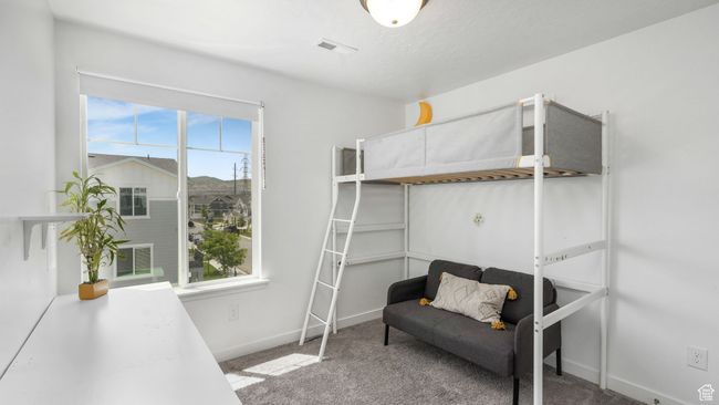 Carpeted bedroom featuring baseboards | Image 18