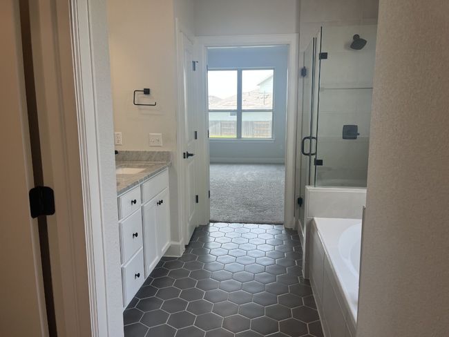 Full bathroom with vanity, a bath, tile patterned floors, and a shower stall | Image 20