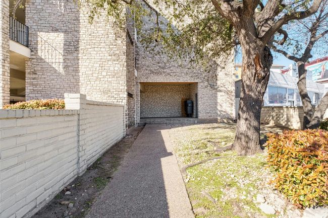 View of side of home featuring fence and brick siding | Image 25