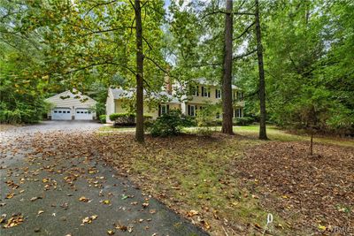 View of front of home with a detached garage | Image 2