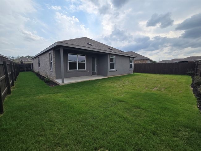 Back of house featuring a patio, a fenced backyard, stucco siding, and roof with shingles | Image 25