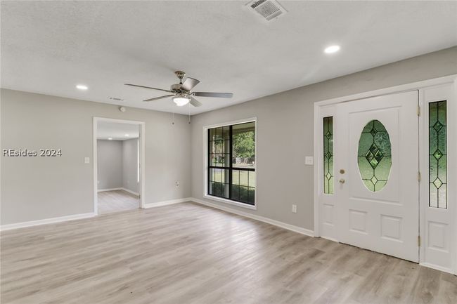 Entryway featuring light hardwood / wood-style floors and ceiling fan | Image 6