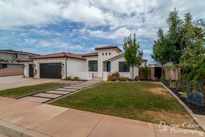 Mediterranean / spanish-style home with a front yard and a garage | Image 3