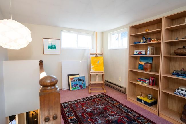 Playroom with a baseboard radiator and carpet flooring | Image 21