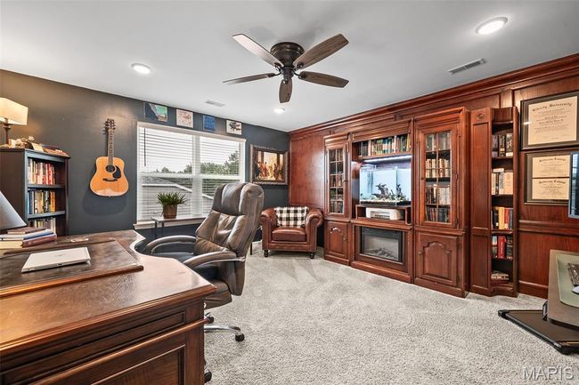 Carpeted office with ceiling fan and recessed lighting | Image 38