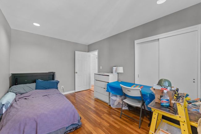 Bedroom with recessed lighting, baseboards, wood finished floors, and a closet | Image 23