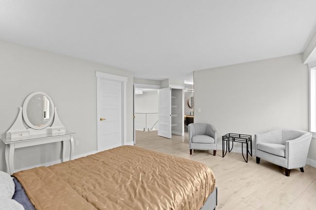Bedroom featuring light wood-style flooring and baseboards | Image 22