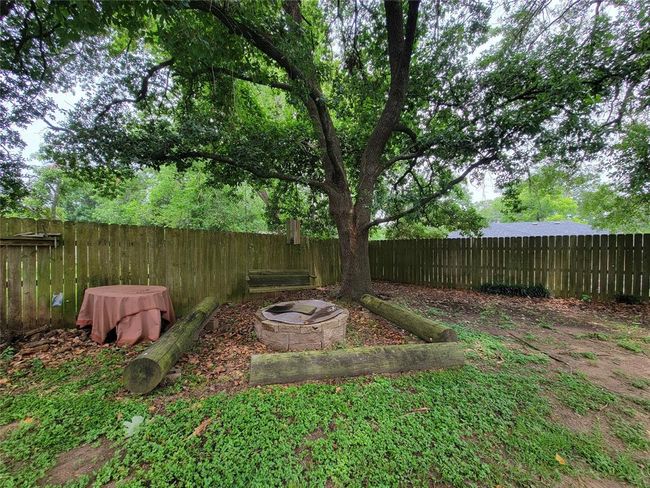 Cozy backyard firepit ideal for stargazing. | Image 36
