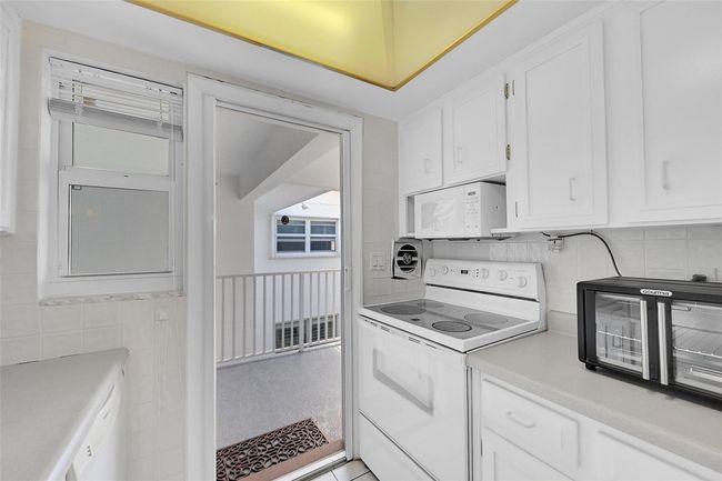 Retractable Screen Doors Shown Here are included in Your Living Room and Kitchen for a No Bug Zone. Can you feel the South Florida Breeze Already? | Image 35