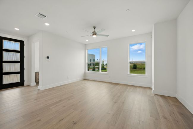 You'll find a light filled family room that the entire family will enjoy in our Camille I plan! | Image 5
