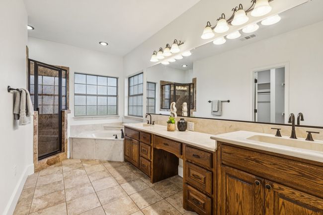 Ensuite primary bathroom with separate shower, large vanity and a garden tub | Image 21