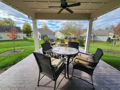 Brand new 16x18 covered porch with stamped concrete and outdoor gas firepit is the perfect place for entertaining. | Image 3