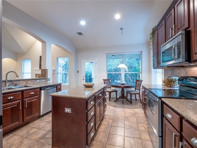 Kitchen with tile floors for easy clean up. | Image 12