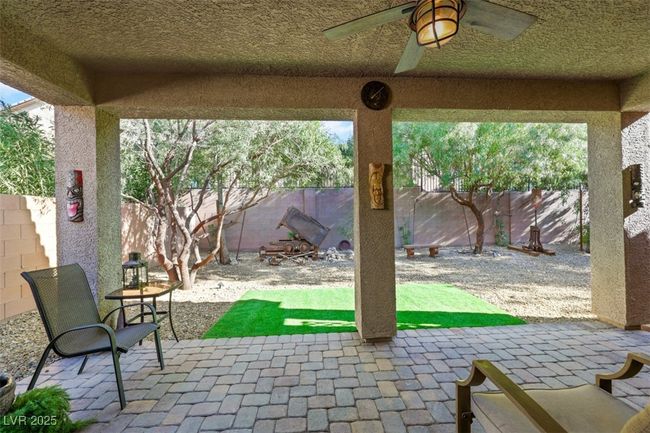 View of patio featuring ceiling fan and a fenced backyard | Image 40