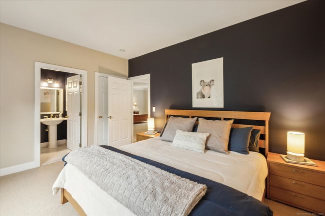 Main level bedroom with ensuite bath. | Image 25