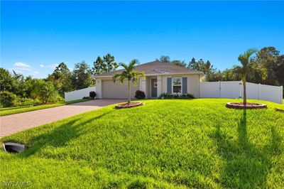 Single story home with a garage and a front yard | Image 3