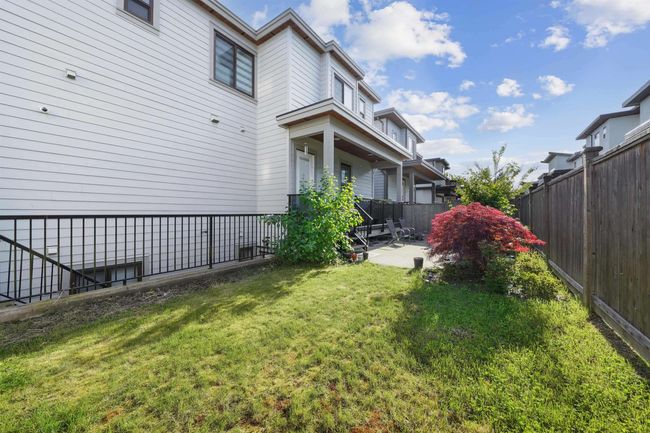 View of yard with a patio and a fenced backyard | Image 4