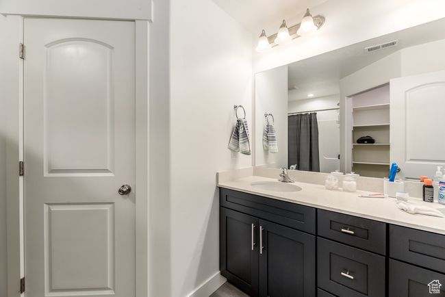 Bathroom with visible vents and vanity | Image 14